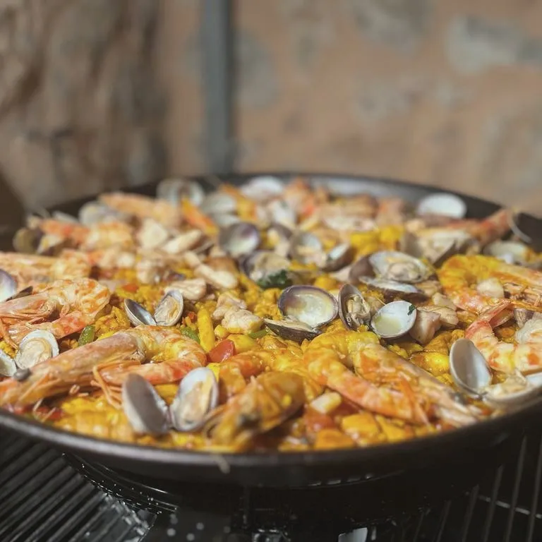 Seafood paella with prawns and clams
